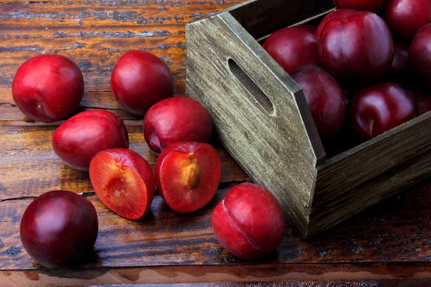 raw-fresh-organic-plums-inside-rustic-fa