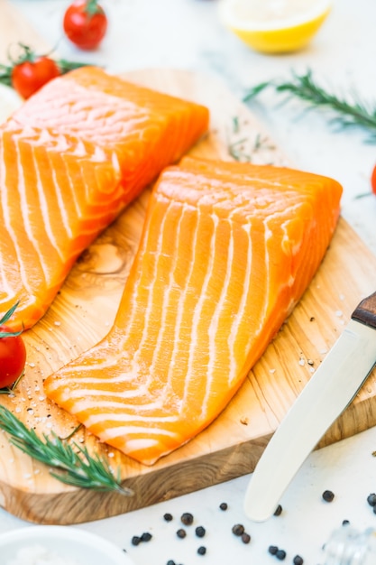 Free Photo | Raw and fresh salmon meat fillet on wooden cutting board