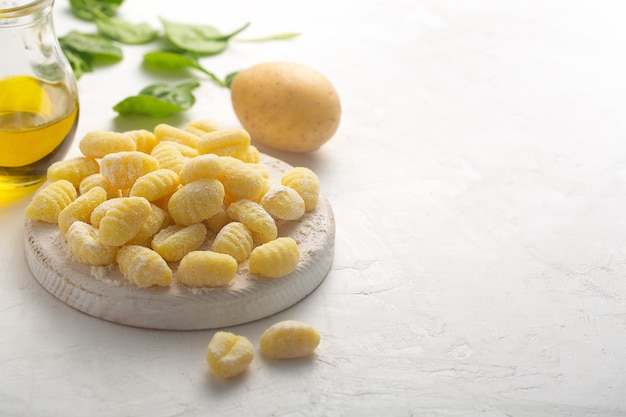 Premium Photo | Raw italian gnocchi on a white background with potato ...