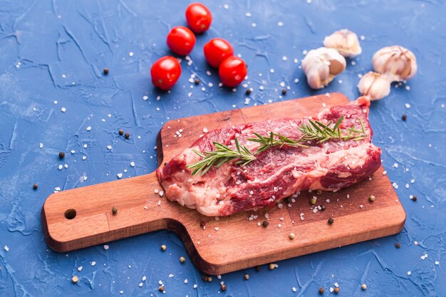 premium-photo-raw-meat-a-large-piece-of-beef-chop-on-a-wooden