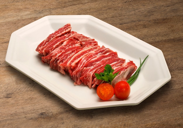 premium-photo-raw-meat-selection-on-wooden-cutting-board