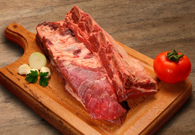 premium-photo-raw-meat-selection-on-wooden-cutting-board