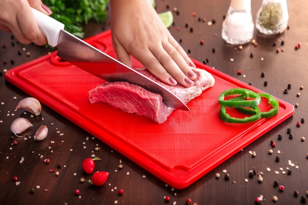 premium-photo-raw-meat-selection-on-wooden-cutting-board