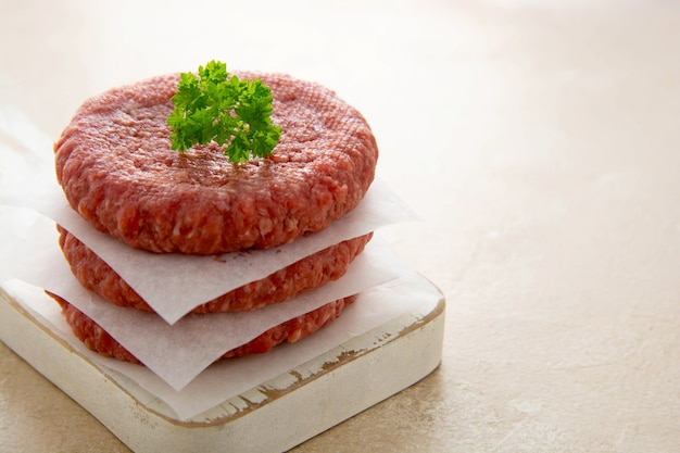 Premium Photo | Raw minced meat for burgers. cooking homemade beef burgers.