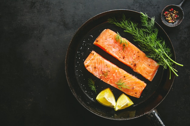 Raw salmon fish on vintage pan Free Photo