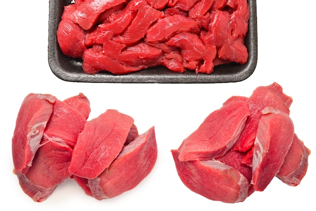 Premium Photo | Raw veal slices in container isolated on white background.