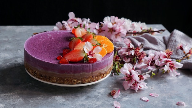 Premium Photo Raw Vegan Cake With Fruit And Seeds Decorated With Flowers