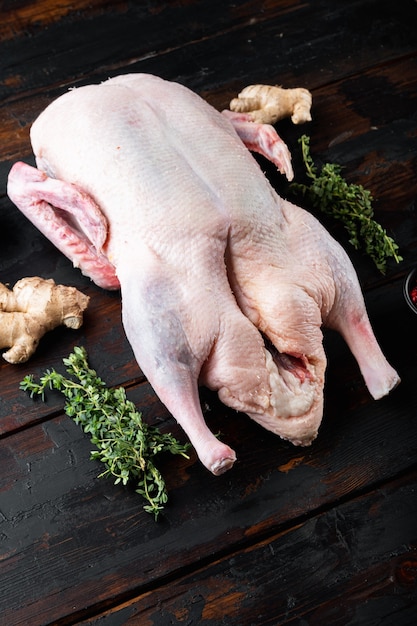 Premium Photo | Raw whole mallard duck meat on dark wooden table.