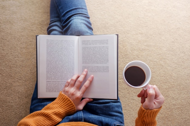 Premium Photo | Reading concept. soft focus of young woman relaxing by book  and coffee in cozy house