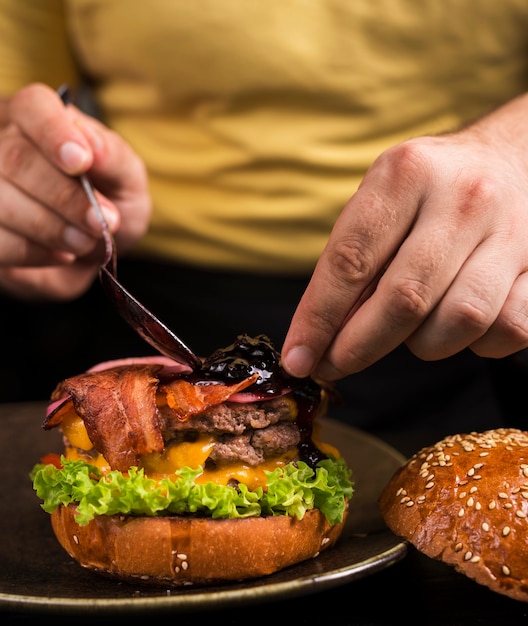 Ready to be served double beef burger with bacon Free Photo
