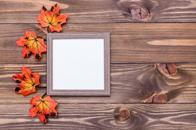 Premium Photo | Ready photo frame on brown wooden background surrounded