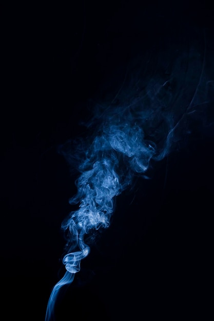 Free Photo | Real blue smoke billowing up on black background