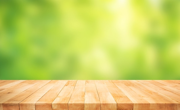 Premium Photo | Real wood table top texture on blur fresh green garden ...