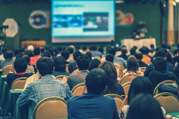 Rear view of audience in the conference hall or seminar meeting Premium Photo