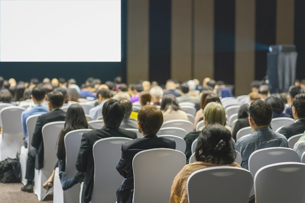 Premium Photo Rear View Of Audience Listening Speakers On The Stage In The Conference Hall Or Seminar Meeting