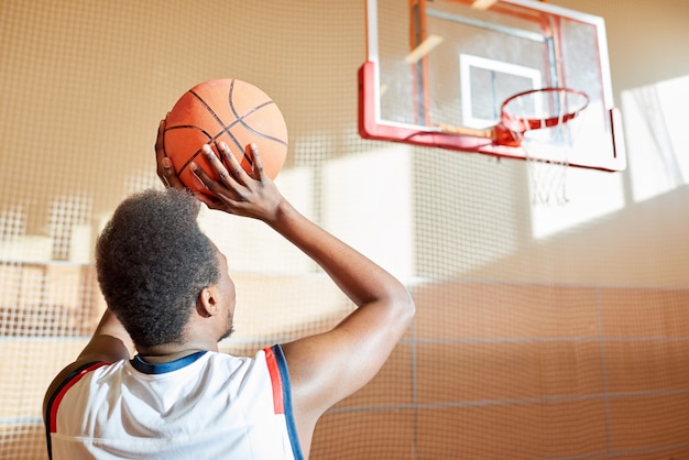 Premium Photo Rear View Of Determined Basketball Player Throwing Ball