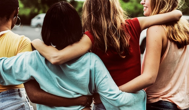 Rear view of a group of diverse woman friends walking together Free Photo