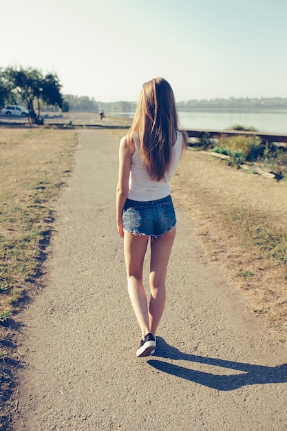 Rear view of teenager walking Photo | Free Download