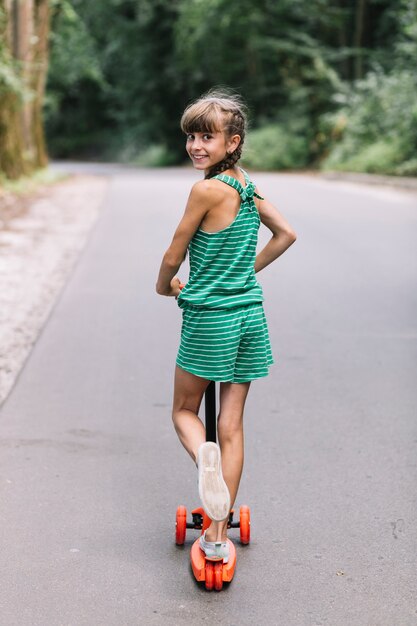 Rear View Of A Smiling Girl Look