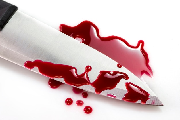 Red blood splatter with kitchen knife | Premium Photo