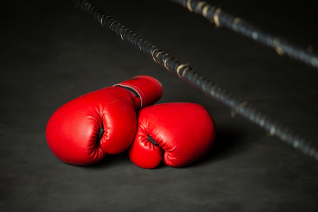 Premium Photo | Red boxing sports, boxing glove on boxing ring in gym