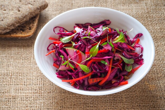 Premium Photo | Red cabbage salad with apples and pecan nuts for ...