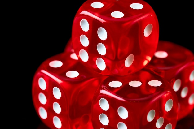 Premium Photo | Red casino dice on black table