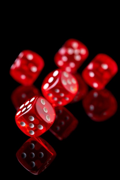 Premium Photo | Red casino dice isolated over black reflective background