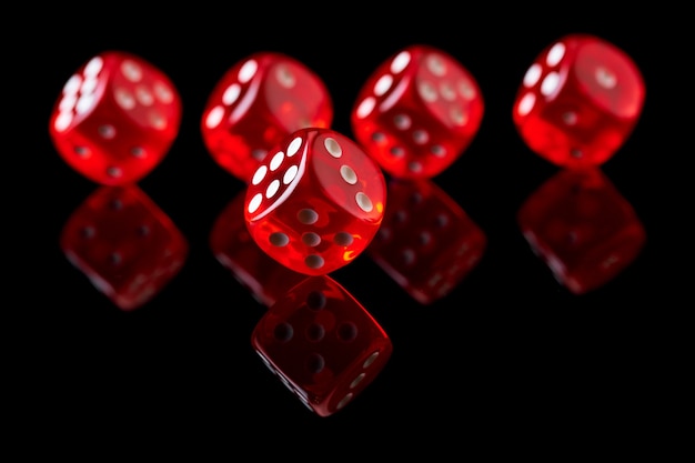 Premium Photo | Red casino dice isolated over black reflective background