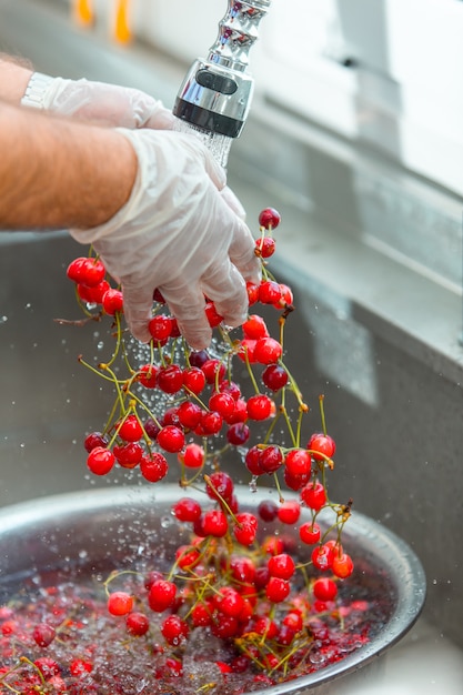 Free Photo | Red cherries washing in the water