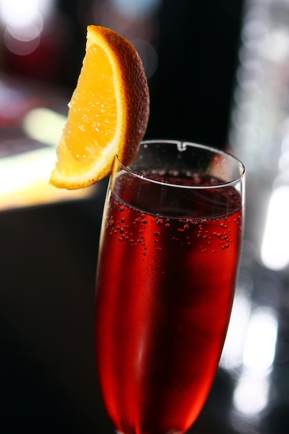 Red cocktail in a champagne glass Photo | Free Download