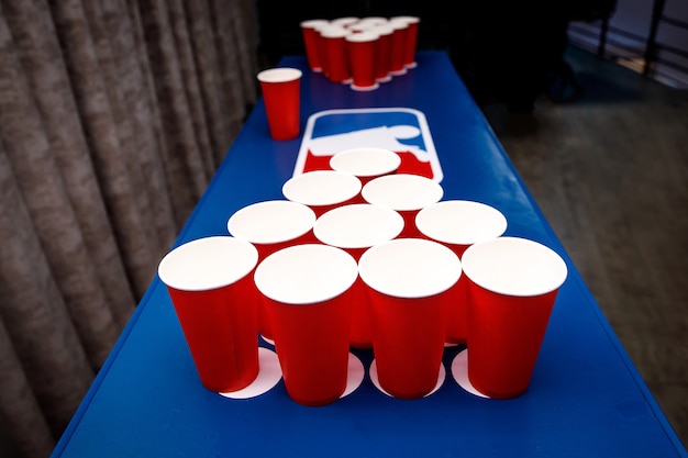 Premium Photo | Red cups set for beer pong.