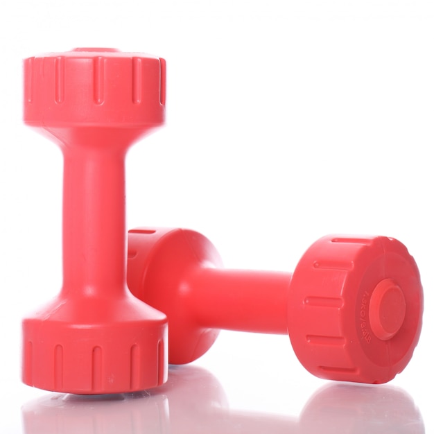 Free Photo | Red dumbbells over white