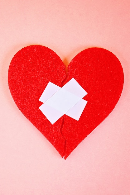 Download Free A Red Felt Heart Broken Into Two Halves Glued Together By Plaster Use our free logo maker to create a logo and build your brand. Put your logo on business cards, promotional products, or your website for brand visibility.