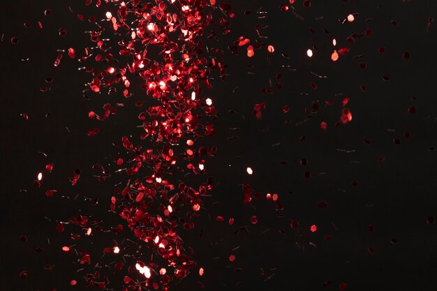 Free Photo | Red glitter on black background