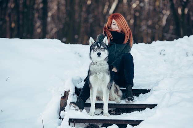 Red-haired girl with a dog | Premium Photo