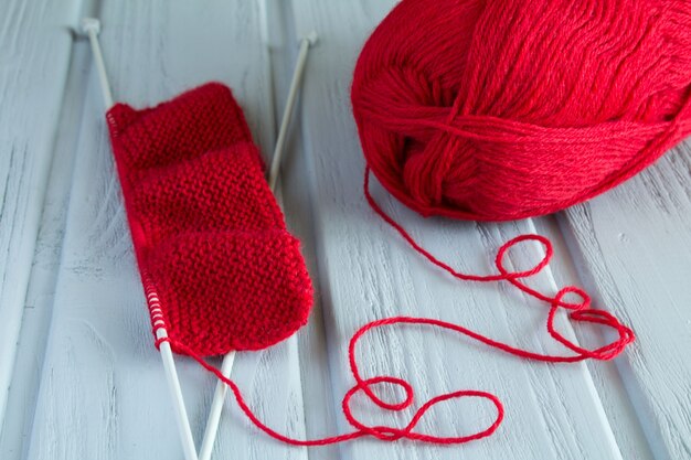 Premium Photo | Red knitting and sample of knitting