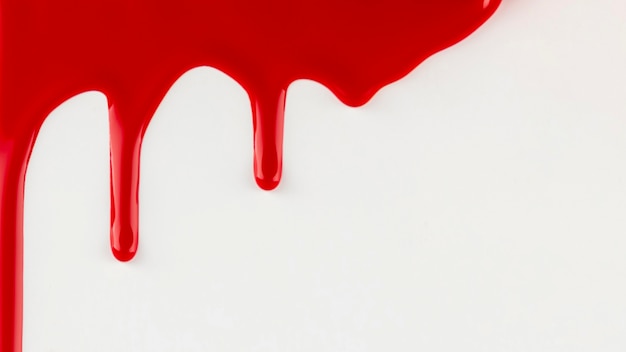 Red paint dripping on white background Photo | Free Download