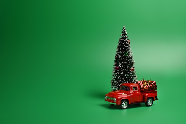 Premium Photo | Red pickup truck with a christmas tree in the back on ...