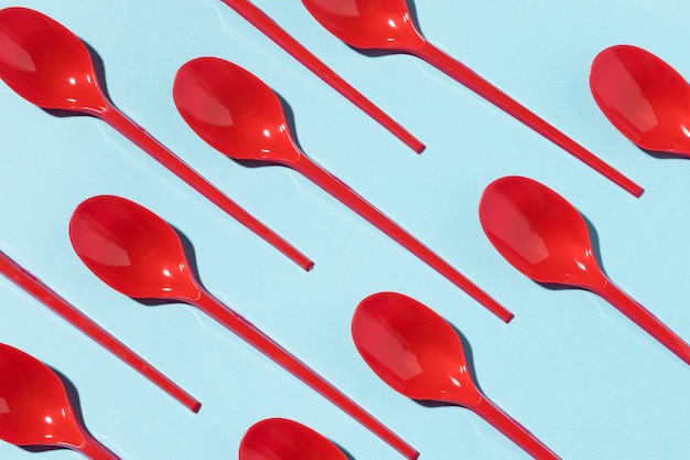 Free Photo | Red plastic spoons top view