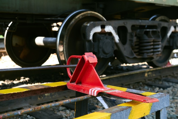 Premium Photo | The red railway brake shoe lies on the rack.