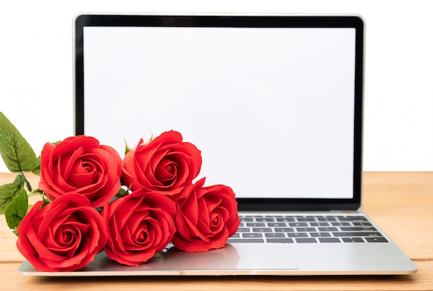 Download Red rose and laptop mockup on white | Premium Photo