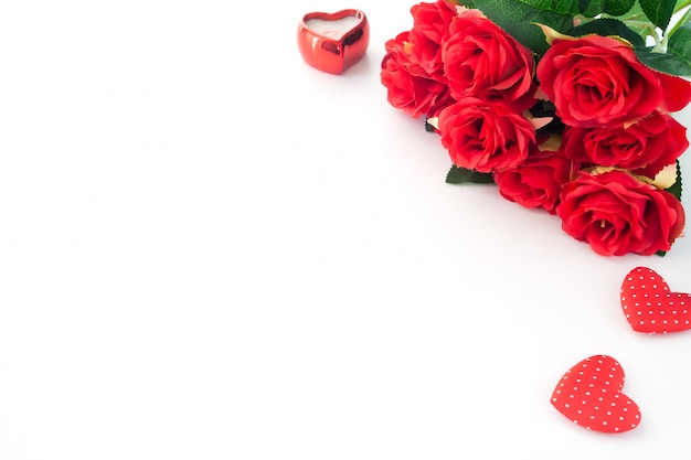 Premium Photo | Red roses and heart on white background