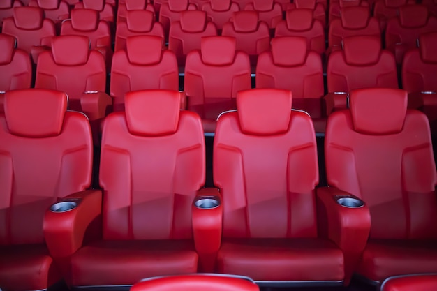 Premium Photo Red Seat In The Movie Theater Blurry Background