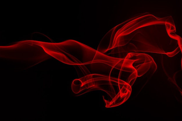 Red smoke abstract on black background. fire design Photo | Premium ...