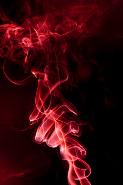 Premium Photo | Red smoke on black background