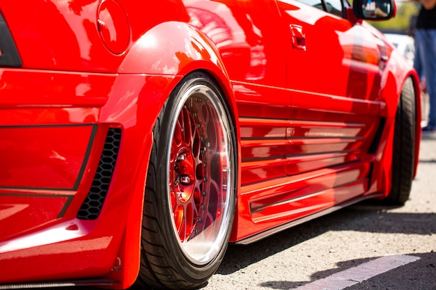 Free Photo Red Sports Tuned Car Rear View Of The Wheel