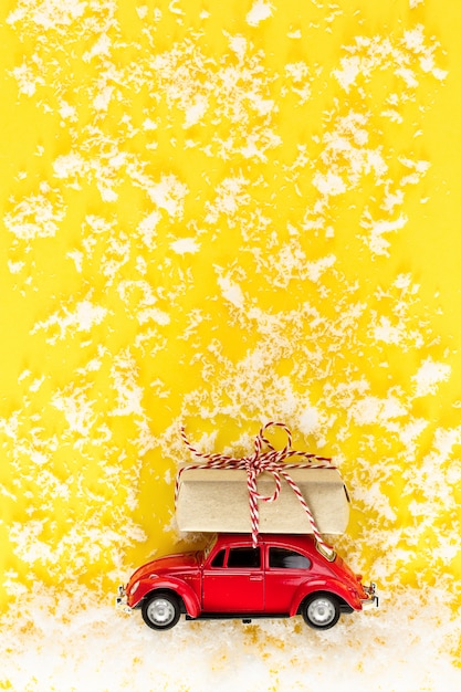 red toy car with yellow roof
