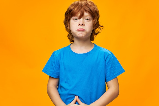 Premium Photo | Redhead boy the offended child pouted his lips blue t ...
