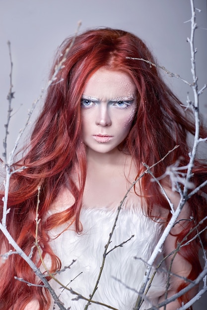 Premium Photo Redhead Girl With Long Hair A Face Covered With Snow